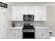 Kitchen with stainless steel appliances and white cabinets at 6014 Cadence Ln, Fort Mill, SC 29707