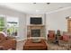 Living room with stone fireplace and comfortable seating at 6014 Cadence Ln, Fort Mill, SC 29707