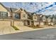 Row of townhouses with attached garages and landscaping at 6014 Cadence Ln, Fort Mill, SC 29707