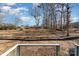 View of backyard from deck, showing trees and grass at 619 Norland Ave, Kannapolis, NC 28083