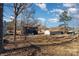 View of backyard showing neighboring houses and trees at 619 Norland Ave, Kannapolis, NC 28083