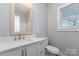 Clean bathroom with white vanity and a mirror at 619 Norland Ave, Kannapolis, NC 28083