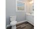 Simple bathroom, featuring a white toilet and vanity at 619 Norland Ave, Kannapolis, NC 28083