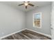 Bedroom with ceiling fan and window offering natural light at 619 Norland Ave, Kannapolis, NC 28083