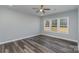 Well-lit bedroom with ceiling fan and wood-look floors at 619 Norland Ave, Kannapolis, NC 28083