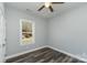 Bedroom with ceiling fan and window overlooking yard at 619 Norland Ave, Kannapolis, NC 28083