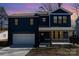 Two-story house with dark blue siding, white garage door, and a stone accent at 619 Norland Ave, Kannapolis, NC 28083