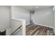 Bright hallway with wood-look floors and access to other rooms at 619 Norland Ave, Kannapolis, NC 28083