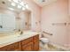 Bathroom with single sink vanity, toilet, shower, and grab bars at 629 Cordova Ct, Salisbury, NC 28146