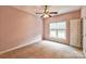 Bedroom with neutral carpet, light pink walls and a ceiling fan at 629 Cordova Ct, Salisbury, NC 28146