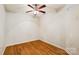Well-lit bedroom featuring hardwood floors, neutral paint, ceiling fan, and ample electrical outlets at 629 Cordova Ct, Salisbury, NC 28146