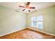 Cozy bedroom featuring hardwood floors, neutral paint, ceiling fan, and a window with natural light at 629 Cordova Ct, Salisbury, NC 28146