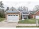 House's front exterior, featuring stone and gray siding at 629 Cordova Ct, Salisbury, NC 28146