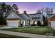 Cozy one-story house with gray siding, stone accents, and a two-car garage at 629 Cordova Ct, Salisbury, NC 28146