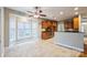 An open kitchen with wood cabinets, stainless steel appliances, tile flooring and an eat in nook at 629 Cordova Ct, Salisbury, NC 28146