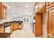 Spacious kitchen with light wood cabinets, granite countertops, and stainless steel appliances at 629 Cordova Ct, Salisbury, NC 28146