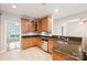 Well-equipped kitchen with granite countertops and abundant wood cabinets at 629 Cordova Ct, Salisbury, NC 28146