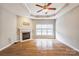 Spacious living room featuring hardwood floors and a fireplace at 629 Cordova Ct, Salisbury, NC 28146