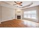 A spacious living room featuring a fireplace, wood floors, and a ceiling fan at 629 Cordova Ct, Salisbury, NC 28146