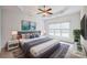 Bright main bedroom with a large bed, grey rug and neutral walls with serene artwork at 629 Cordova Ct, Salisbury, NC 28146