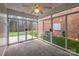 Enclosed sunroom with full glass walls and view of the backyard at 629 Cordova Ct, Salisbury, NC 28146