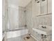 Bathroom with vintage vanity and tiled walls at 6439 Montpelier Rd, Charlotte, NC 28210