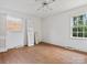 Bright bedroom with hardwood floors and window at 6439 Montpelier Rd, Charlotte, NC 28210