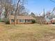 Brick Ranch house with teal shutters at 6439 Montpelier Rd, Charlotte, NC 28210