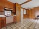 Retro kitchen with wood paneling and vintage stove at 6439 Montpelier Rd, Charlotte, NC 28210