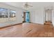 Hardwood floors and teal door in spacious living room at 6439 Montpelier Rd, Charlotte, NC 28210