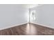 Well-lit bedroom with hardwood floors and a window at 646 Central Nw Dr, Concord, NC 28027