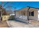 Newly renovated home with covered porch and gate at 646 Central Nw Dr, Concord, NC 28027