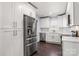 Modern kitchen with white cabinets and stainless steel appliances at 646 Central Nw Dr, Concord, NC 28027