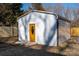 Metal storage shed with yellow door and side wall at 646 Central Nw Dr, Concord, NC 28027