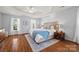 Spacious primary bedroom with hardwood floors and large windows at 6700 Fairhope Ct, Charlotte, NC 28277