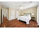 Comfortable bedroom with hardwood floors and access to hallway at 6700 Fairhope Ct, Charlotte, NC 28277