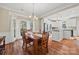 Bright dining room with hardwood floors and a wood table at 6700 Fairhope Ct, Charlotte, NC 28277