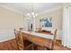 Spacious dining area with hardwood floors and large windows at 6700 Fairhope Ct, Charlotte, NC 28277