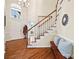 Bright entryway with hardwood floors and coat rack at 6700 Fairhope Ct, Charlotte, NC 28277