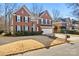 Brick two-story house with attached garage and manicured lawn at 6700 Fairhope Ct, Charlotte, NC 28277