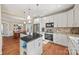 Spacious kitchen with granite countertops, white cabinets, and stainless steel appliances at 6700 Fairhope Ct, Charlotte, NC 28277