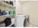 Laundry room with washer, dryer and shelving at 6700 Fairhope Ct, Charlotte, NC 28277