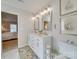 Bright bathroom with double vanity and view into bedroom at 6706 Blackwood Ln, Waxhaw, NC 28173