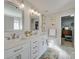 Bathroom with double vanity, quartz countertops, and marble floors at 6706 Blackwood Ln, Waxhaw, NC 28173