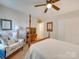 Bright bedroom with double bed, TV, and ample closet space at 6706 Blackwood Ln, Waxhaw, NC 28173