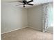 Serene bedroom with neutral carpet features stylish curtains and a ceiling fan at 6706 Blackwood Ln, Waxhaw, NC 28173