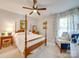 Bright bedroom with a comfortable sitting area and a queen-size bed at 6706 Blackwood Ln, Waxhaw, NC 28173