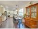 Eat-in kitchen with farmhouse table and antique hutch at 6706 Blackwood Ln, Waxhaw, NC 28173