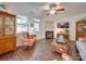 Cozy living room with fireplace, hardwood floors, and comfortable seating at 6706 Blackwood Ln, Waxhaw, NC 28173