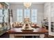 Farmhouse-style dining room with a large table and built-in hutch at 680 Chase Ct, Fort Mill, SC 29708